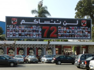 Billboard for the martyrs of the Port Said massacre of the Ultra Ahli fans at the entrance gate of the Ahli Club, Zamalek island,   Written on top  “We will not forget you”. Captured 8 February 2013