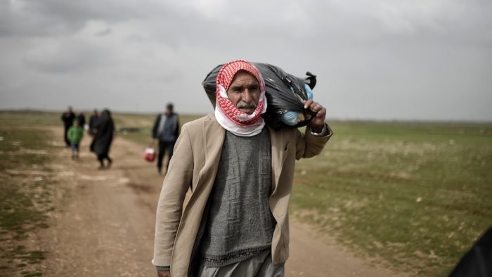 SANL?URFA,TURKEY, 18 FEBRUARY 2015 Syrian refugees walking on Turkey-Syria border in Suruc district.