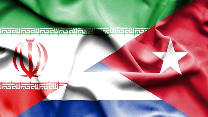 Waving flag of Cuba and Iran