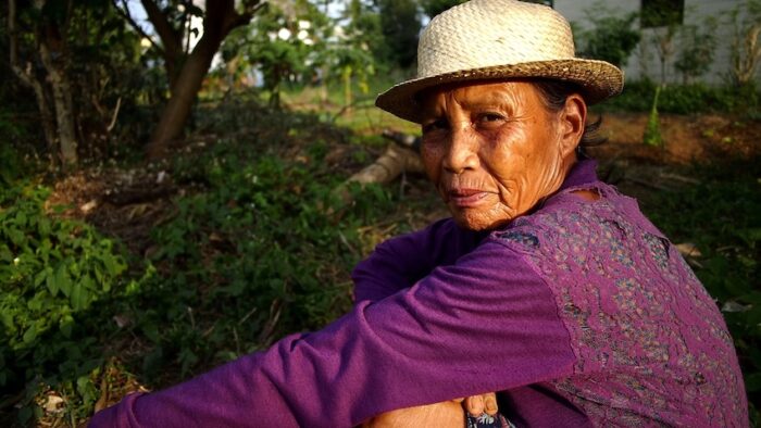ANTIPOLO CITY, PHILIPPINES - MARCH 28, 2018: A farmer takes a break and pose for the camera.