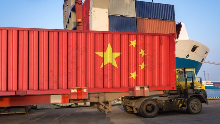 cargo container with the china flag during unloading at the port