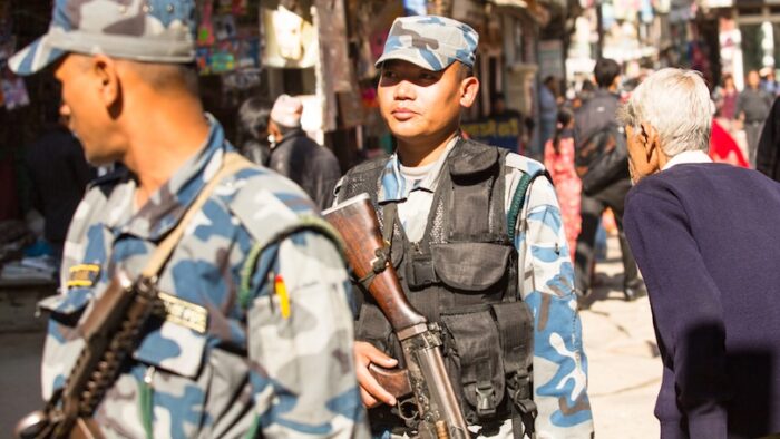 KATHMANDU, NEPAL - NOV 29: Soldiers during protest within a campaign to end violence against women (VAW), Nov 29, 2013 in Kathmandu, Nepal. Held annually since 1991, 16 days Nov 25 - Dec 10.