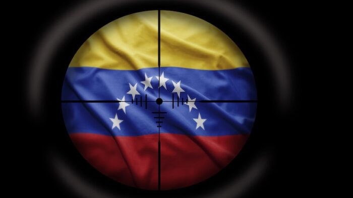 Sniper scope aimed at the Venezuelan flag