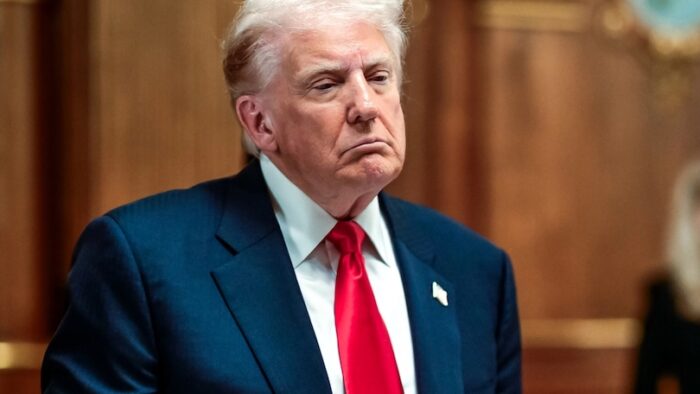 President trump observes toast with man holding glass